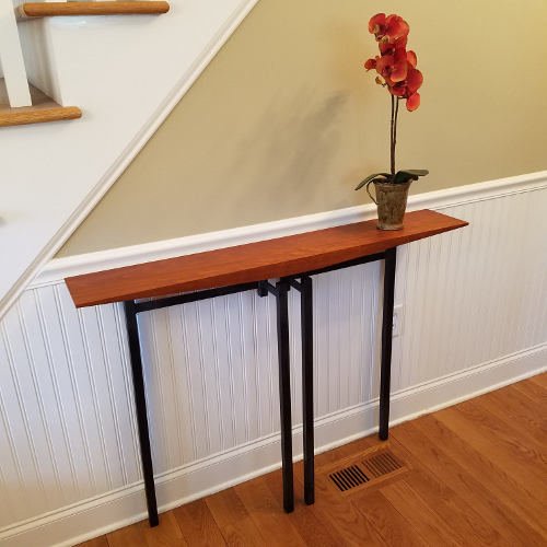Hall table in black cherry and oil-flamed welded steel