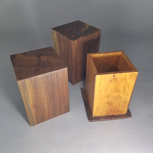 Black walnut and black cherry urns to hold creamation ashes