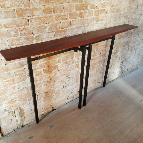 Hall table in salvaged mahogany and oil-flamed welded steel