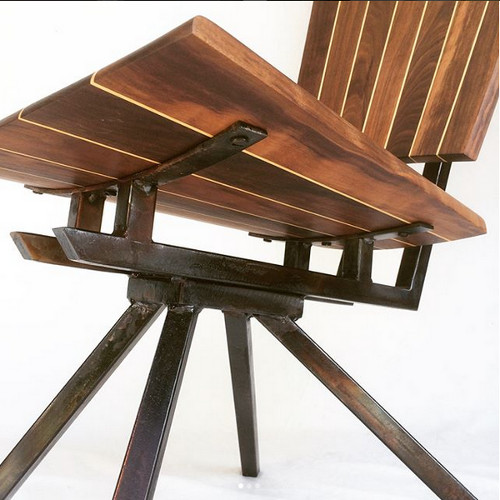 Detail of a coopered and tapered black walnut, American holly, and oil-flamed welded steel chair